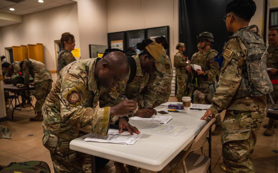 Veterans signing paperwork